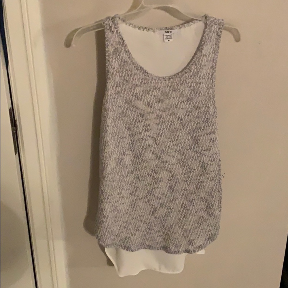 Knit and white blouse.